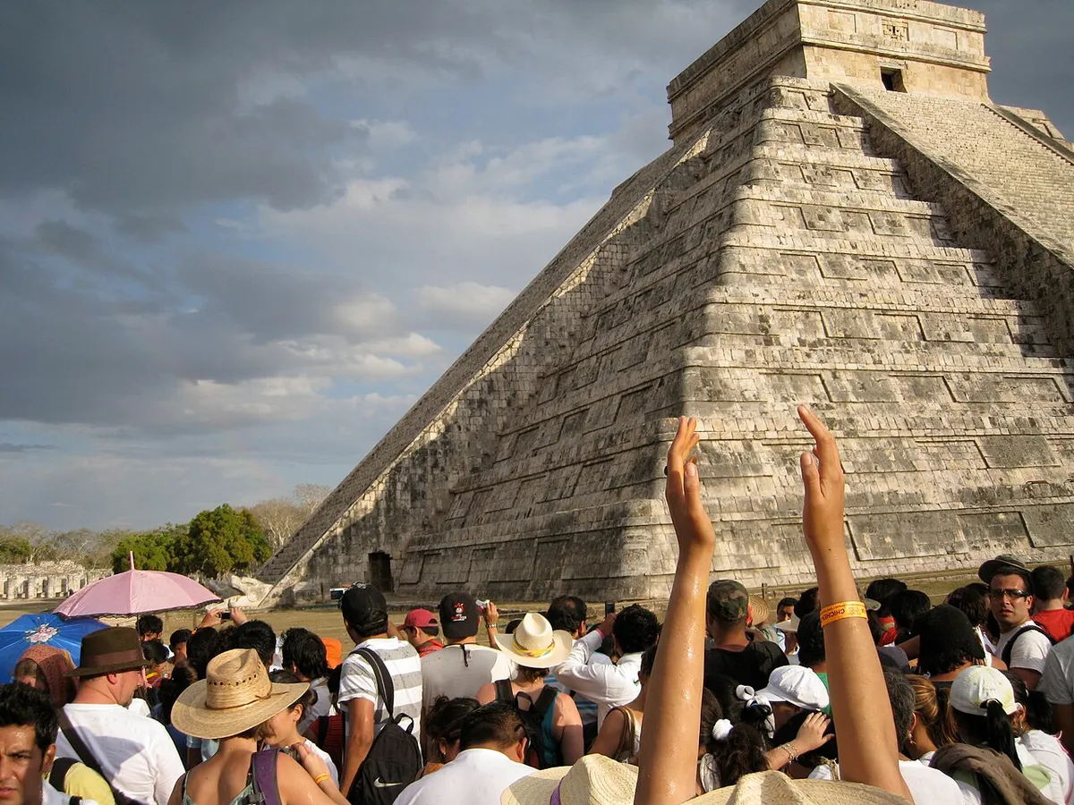 Serpent head at the base of El Castillo before buying Chichen Itza tickets in advance, Yucatan, Mexico