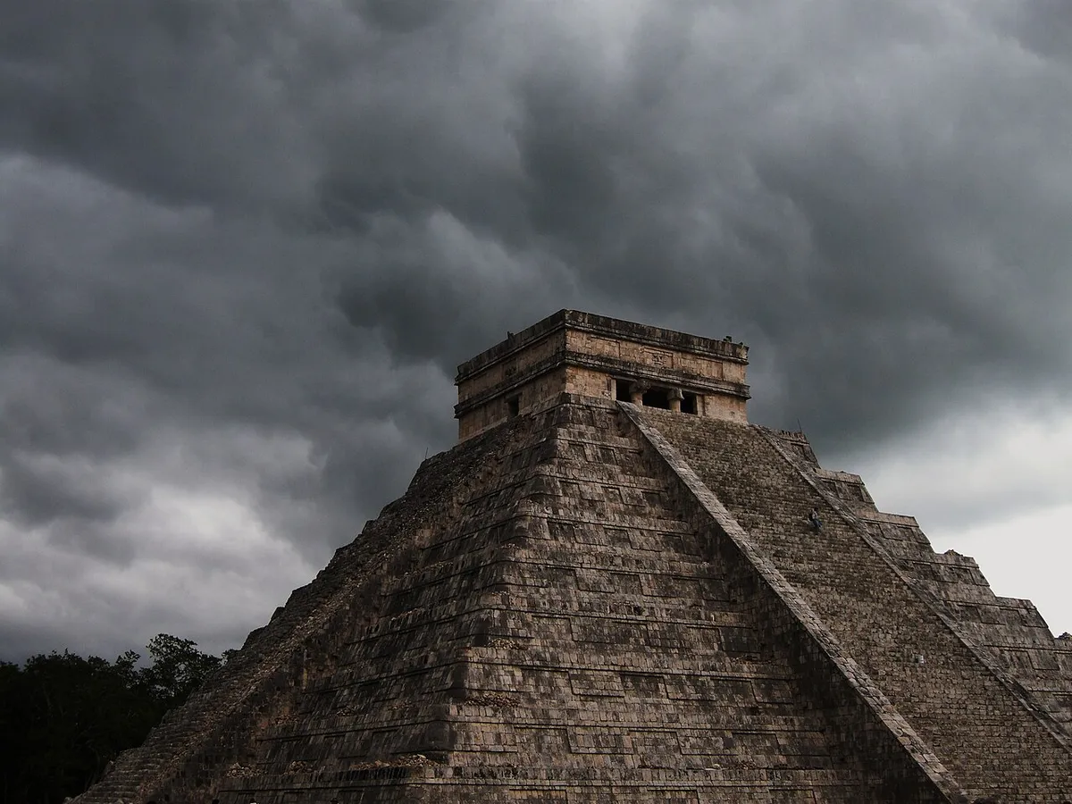 Storm building over Chichen Itza in the green season when buying tickets in advance matters less, Yucatan, Mexico